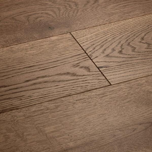 Warm-toned harlech coffee oak hardwood flooring with natural wood grain pattern and subtle knots