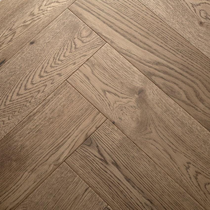 Highclere biscotti oak light brown oak hardwood flooring with a herringbone pattern for elegant interiors