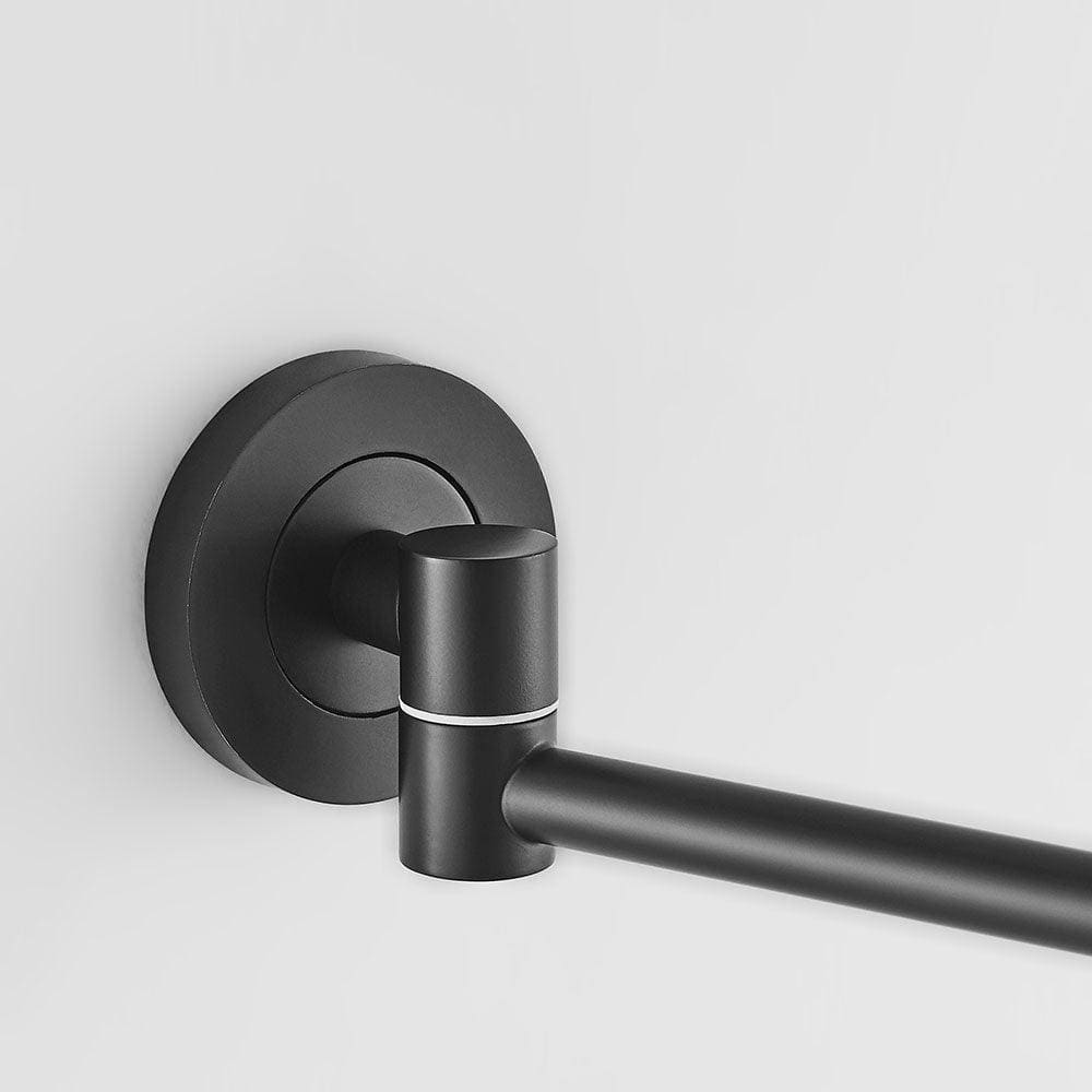 Black matte finished towel rack with sleek modern design and subtle silver accent ring for hutton reversible 5x magnifying wall mirror black