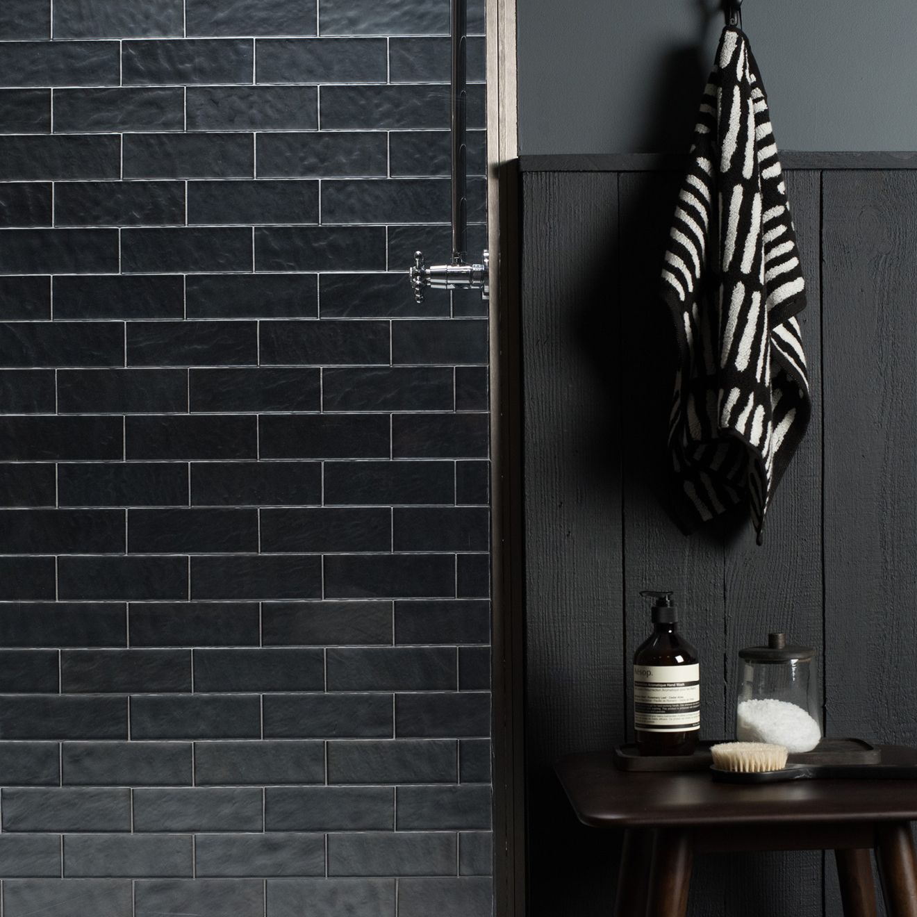 Janus eclipse black textured subway tile wall featuring glossy ceramic finish for modern interiors