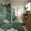 Green hexagon porcelain tiles by clarissa hulse with tropical leaf patterns covering shower walls and floor