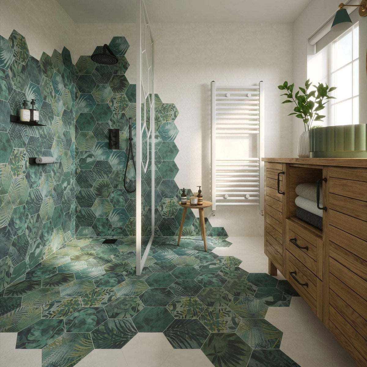 Green hexagon porcelain tiles by clarissa hulse with tropical leaf patterns covering shower walls and floor