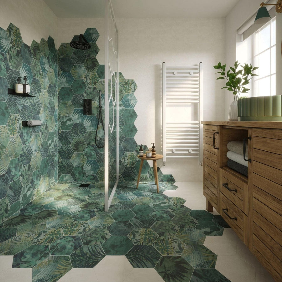 Green hexagon porcelain tiles by clarissa hulse with tropical leaf patterns covering shower walls and floor
