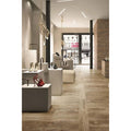 Kingfisher Teak light brown wood-effect floor tiles with red high-heeled shoes on a pedestal
