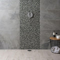 Lial Earth and Fire Mixed Mosaics black and grey stone and glass mosaic with a chrome showerhead