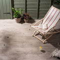 Lignum Grey Natural Rectified Glazed Porcelain grey wood-effect porcelain tiles with a striped deck chair