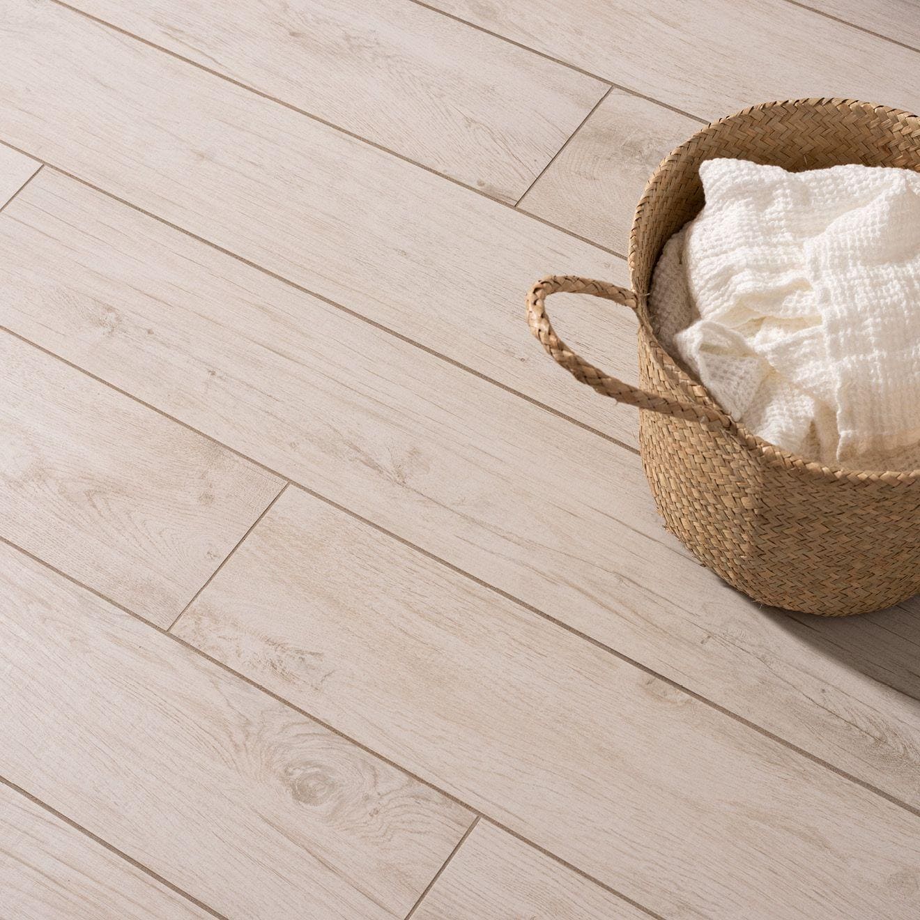 Lignum White Natural Rectified Glazed Porcelain white wood-effect porcelain tiles with a woven straw basket