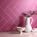 Mackenzie Clear Glass 300 x 100mm pink glass tiles with a white ceramic pitcher