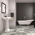 White clawfoot bathtub with chrome feet and classic curved design in metro black matt finish