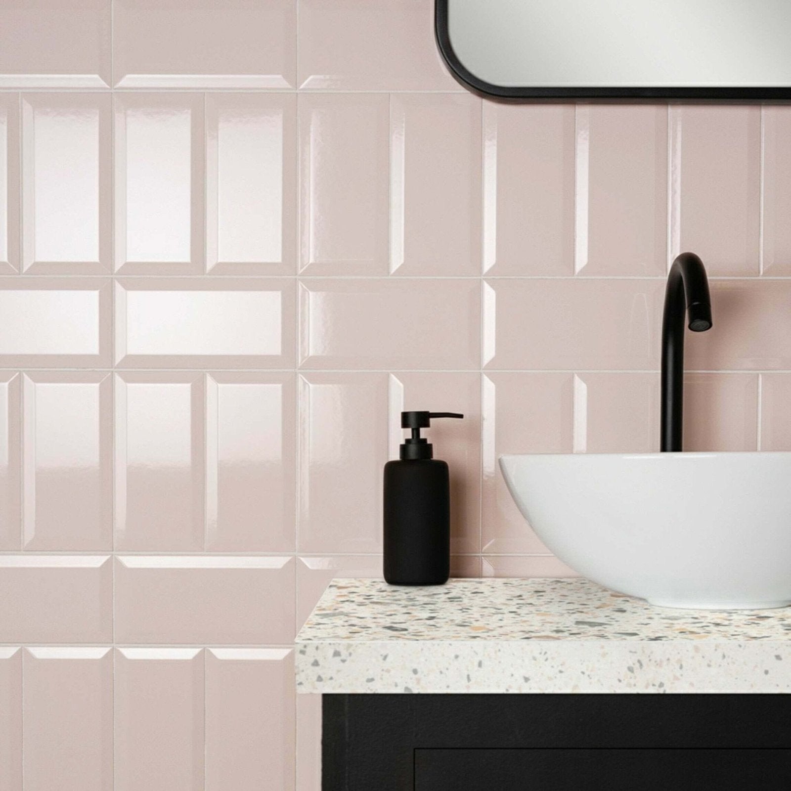 Metro Light Pink Gloss pink gloss ceramic tiles with a black soap dispenser