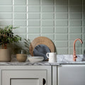 A white ceramic pitcher with a heart-shaped handle and subtle glossy finish from Metro Sage Gloss collection