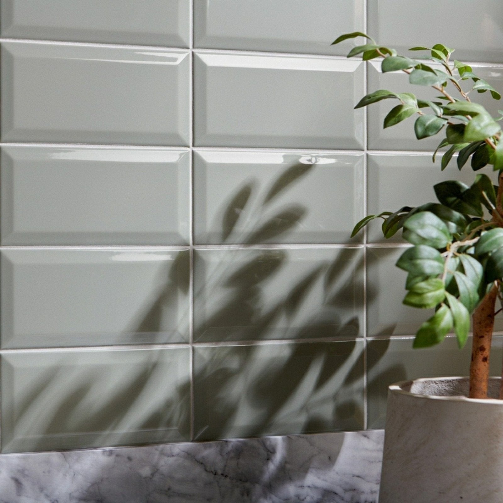 Gray glossy rectangular metro sage gloss tiles with subtle raised border pattern for stylish wall decor