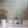 Copper-finished metro sage gloss kitchen faucet with curved spout and single lever handle for easy use