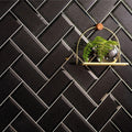Mira Metallic Glass Bevel 200 x 100mm black textured metallic glass tile with a gold shelf and fern