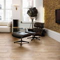 Mumble C Honey Oak Tiles honey oak wood-effect tiles with a black leather lounge chair and ottoman