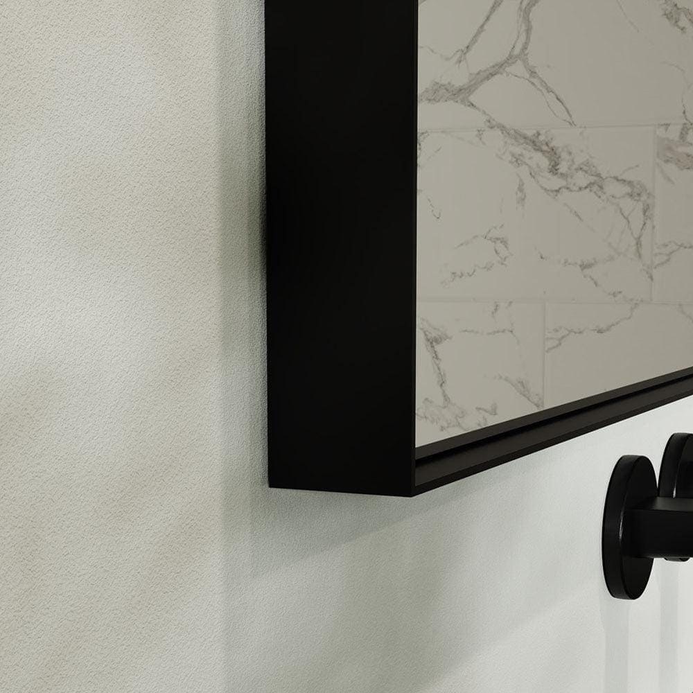 Black-framed rectangular Newington mirror 100x80cm with a sleek modern design mounted on a textured wall