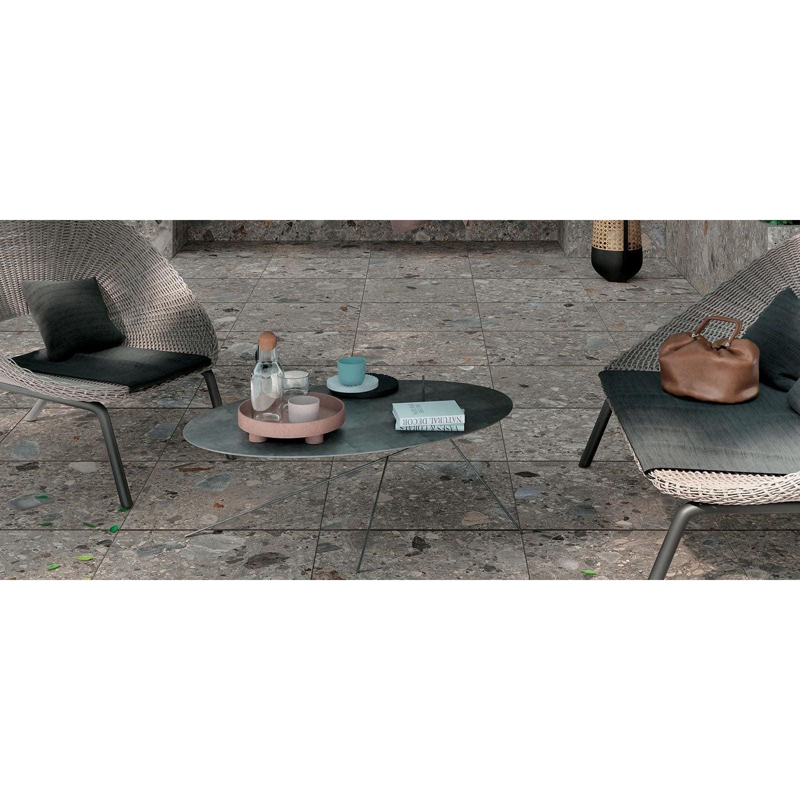 Modern oval coffee table norway farge matt with dark matte surface and slender metal legs for stylish living spaces