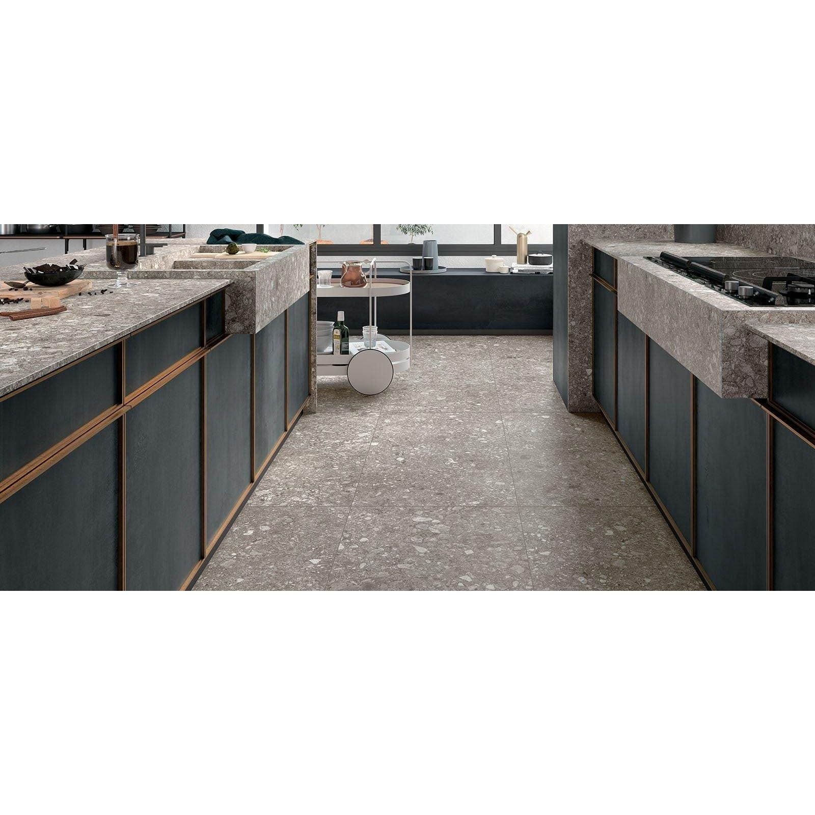 Norway Gra Matt grey terrazzo-effect tiles with dark grey kitchen cabinets and countertops