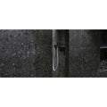 Norway Svart Matt dark grey terrazzo-effect tiles with a black showerhead