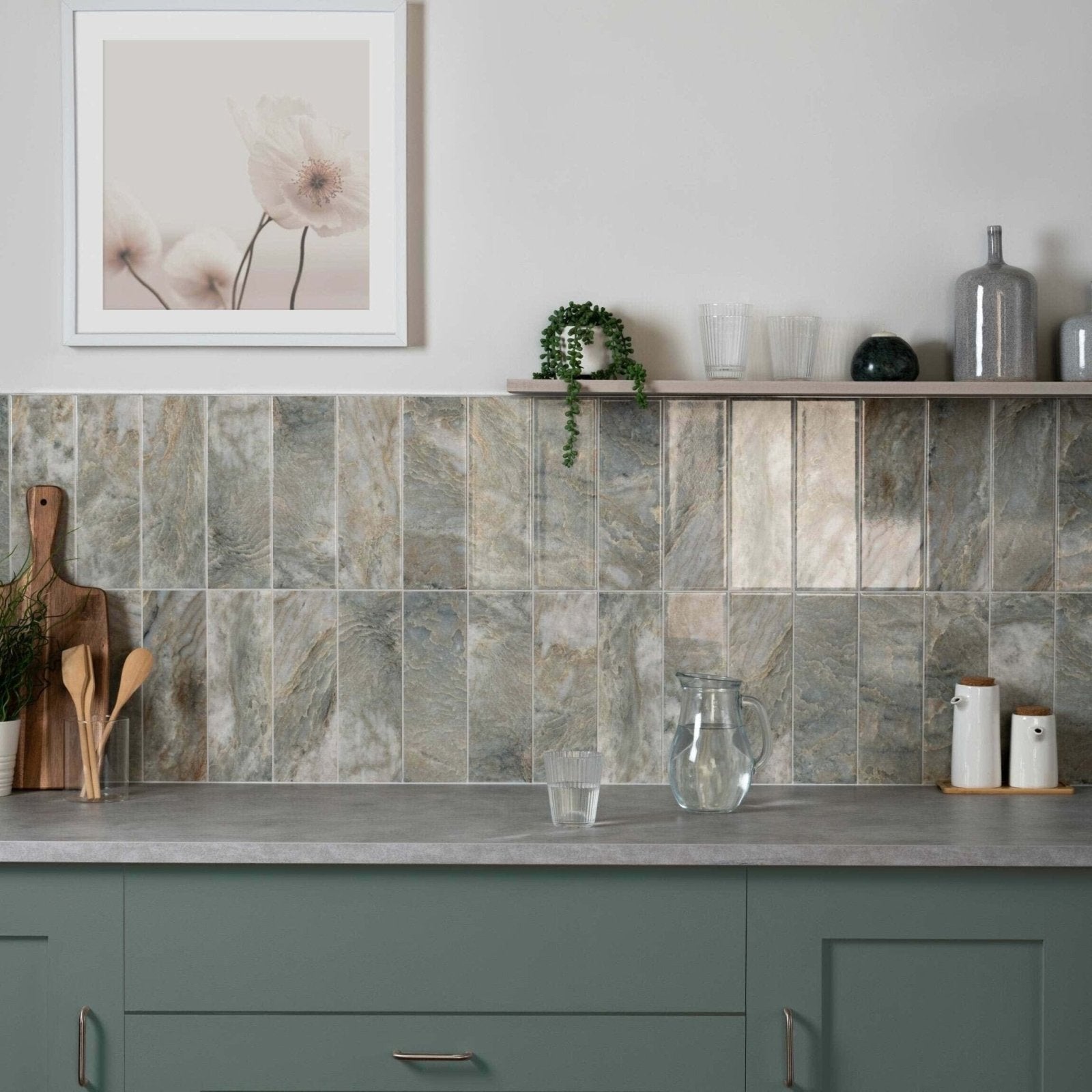 Gray marble-effect subway tiles with subtle veining creating a sleek backsplash in onix verde collection