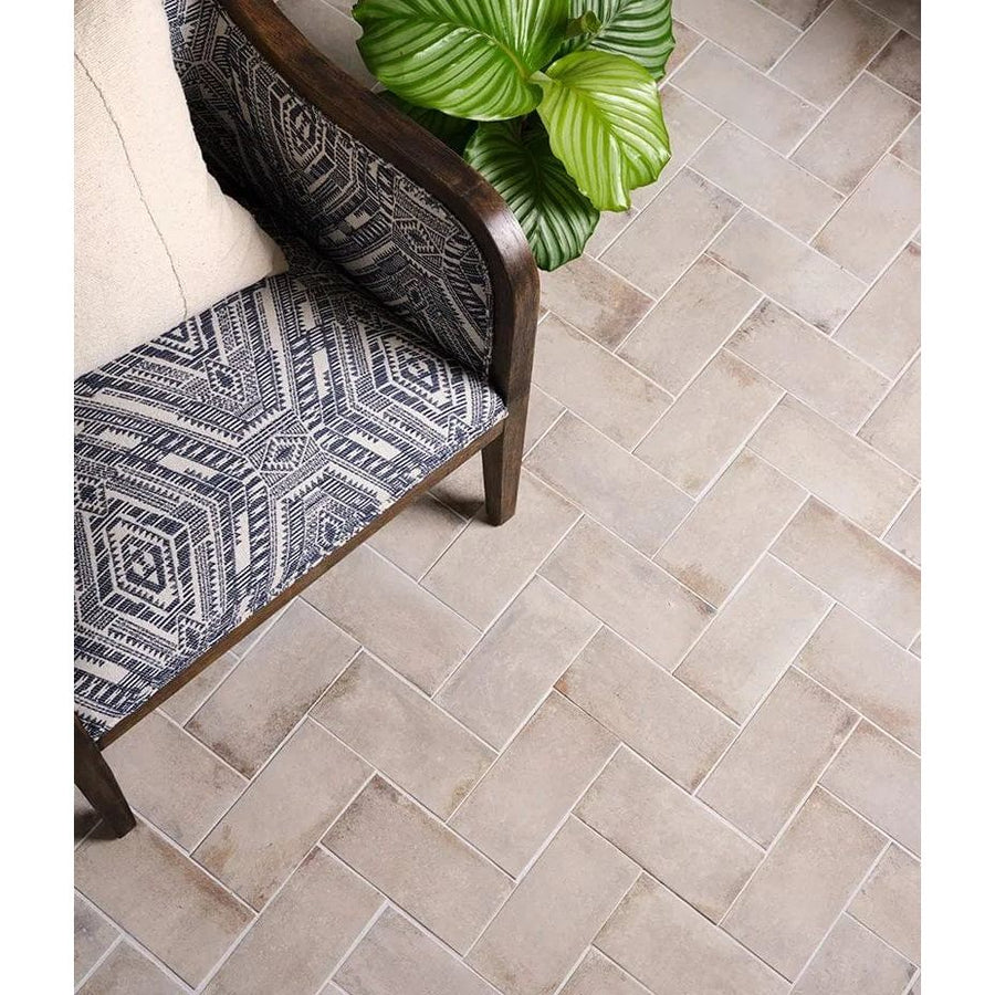 Gray herringbone patterned floor tiles in osterley porcelain white brick for durable and stylish interior flooring