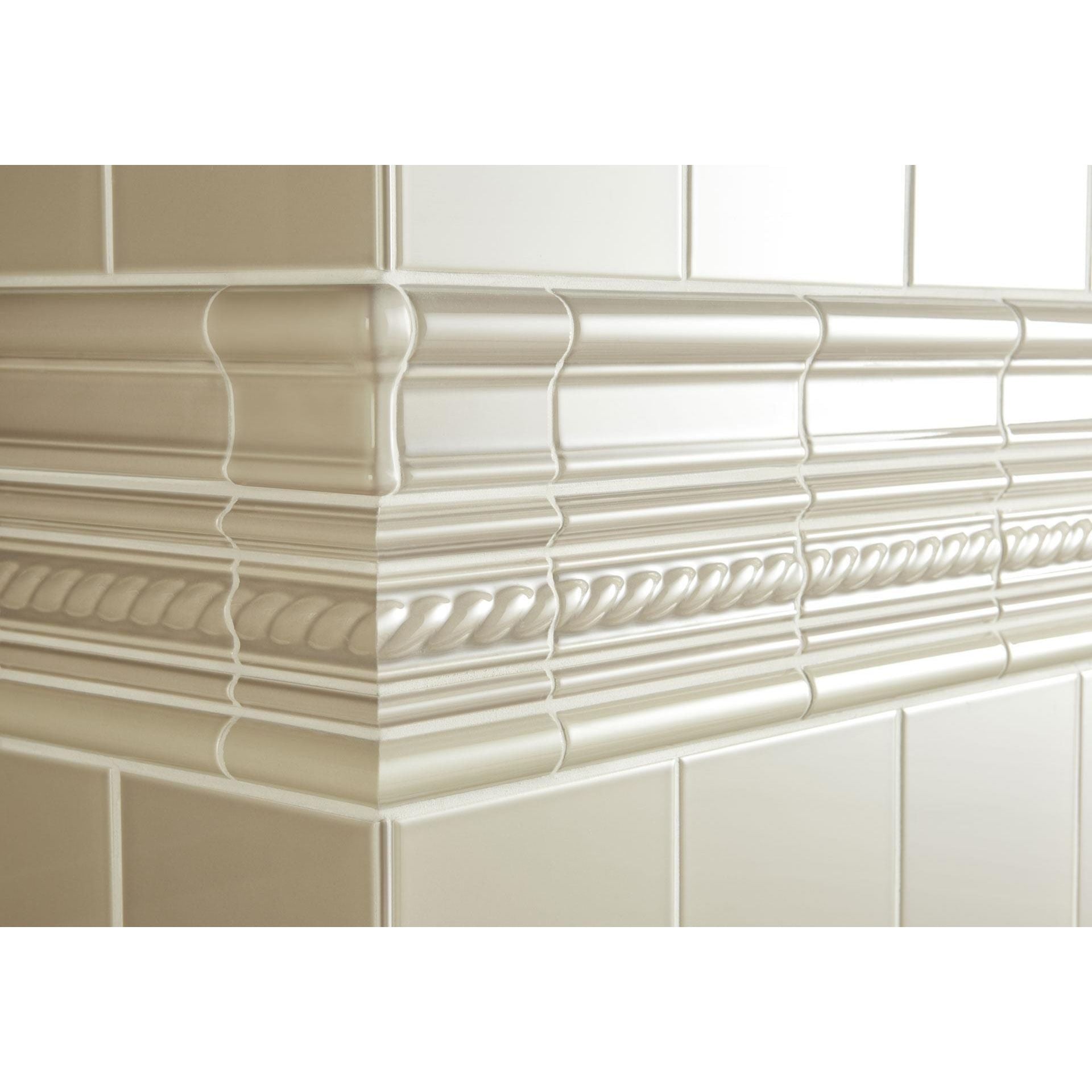 Cream-colored glossy ceramic Palladian Beige astragal moulding with intricate rope and beaded detailing trim
