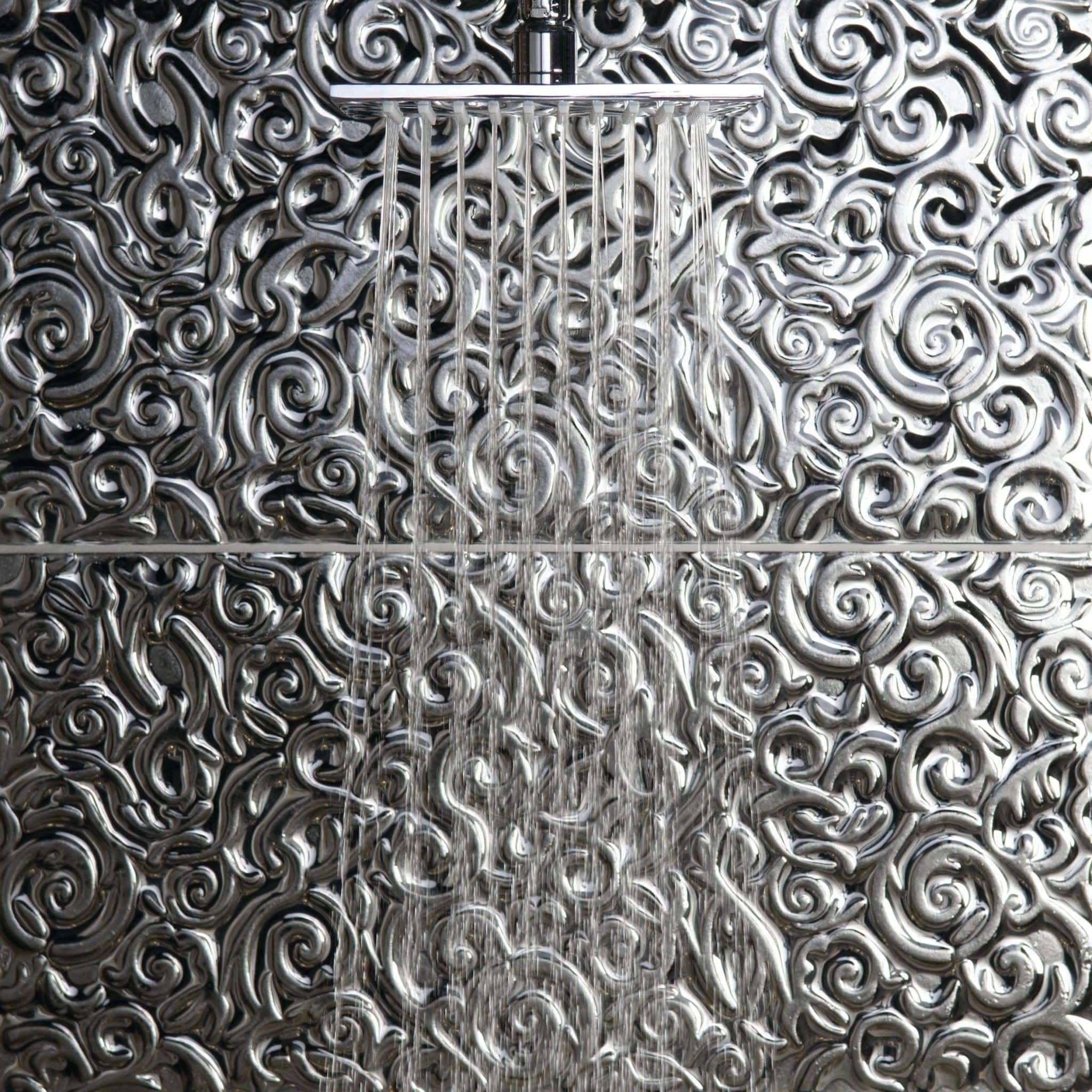 Pharaoh Decorative Glass black metallic glass tiles with an ornate showerhead