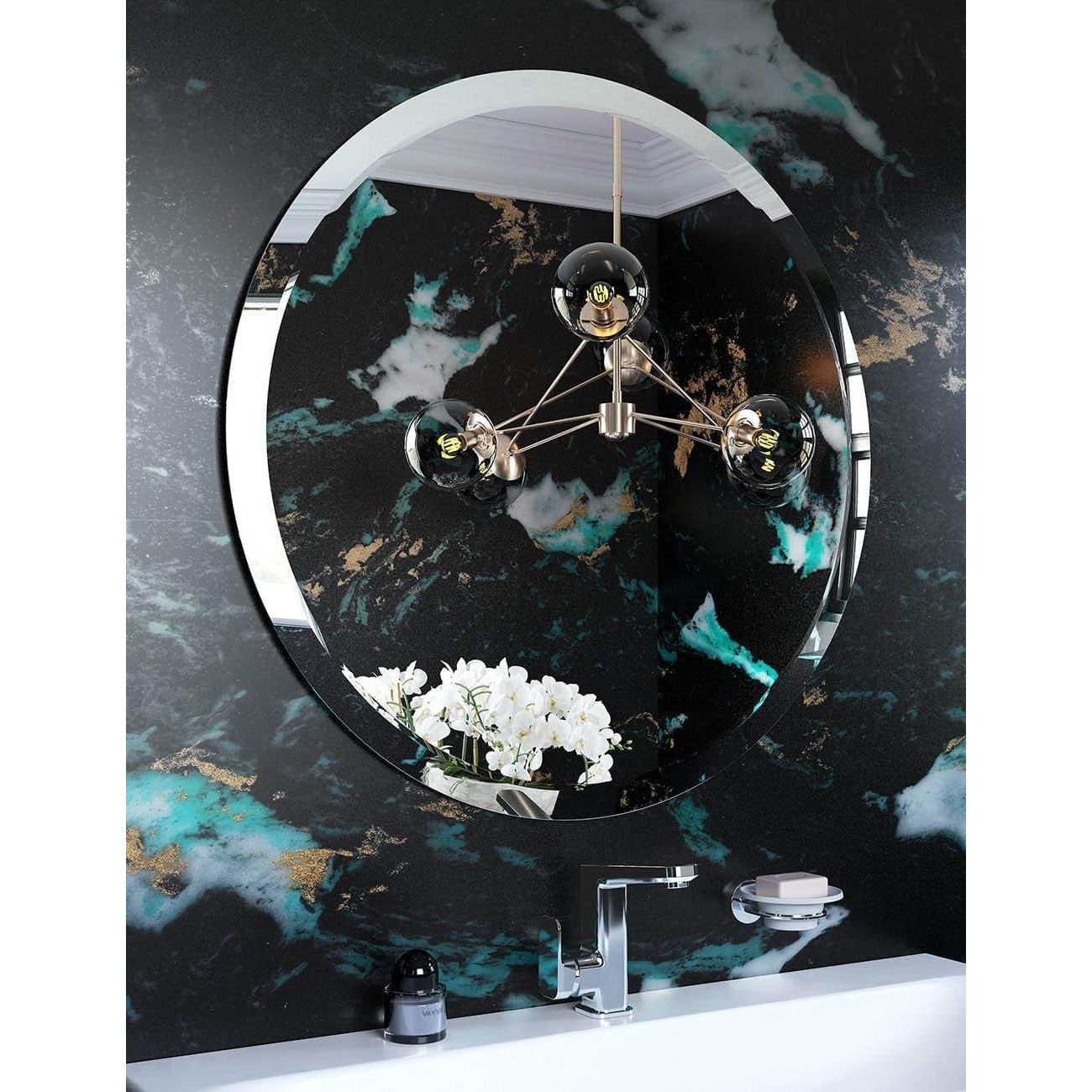Porterhouse round mirror 60 with sleek chrome frame reflecting chandelier and white orchids on dark marble wall