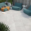 Pulse grey tiles made of gray marble-effect patio tiles with subtle veining and a smooth polished finish
