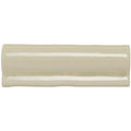 Cream-colored glossy ceramic pumice torus moulding tile with subtle curved edge and smooth surface for decorative trim