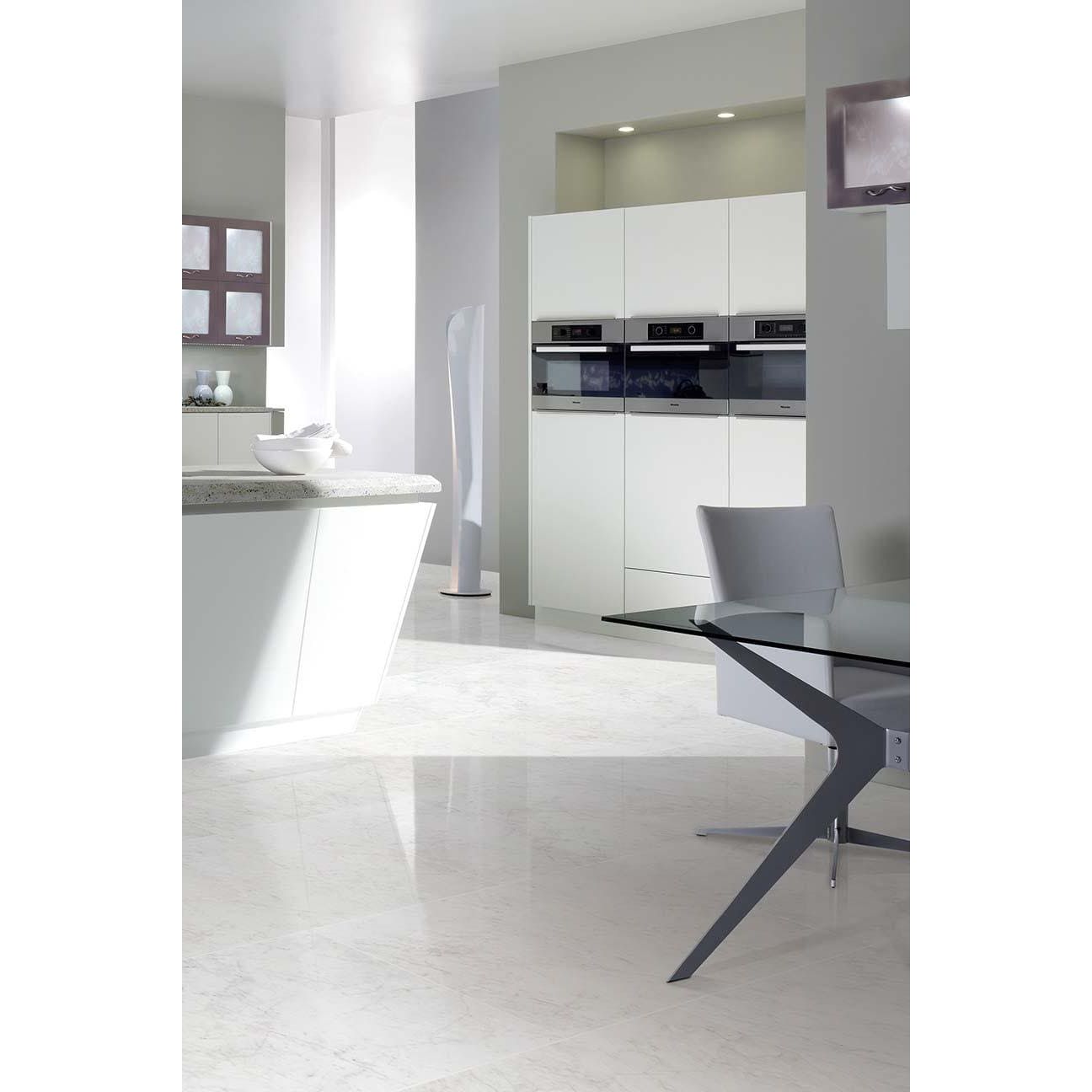 Modern white kitchen cabinets with sleek minimalist design and integrated stainless steel appliances in python carrara porcelain gloss