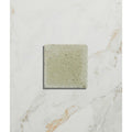 Square textured reform composite stone tumbled concrete tile in muted sage green finish called mint