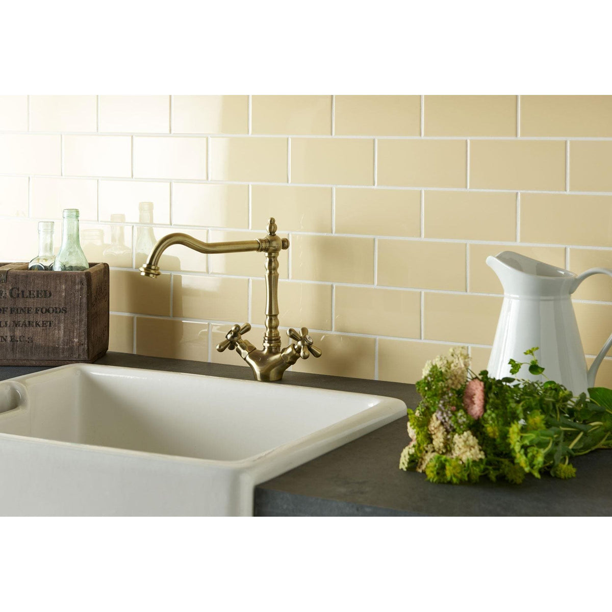 Regency Cream Half Tile cream ceramic half tiles with an antique brass tap