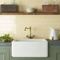 Regency Cream Half Tile cream ceramic half tiles with a farmhouse sink and brass tap