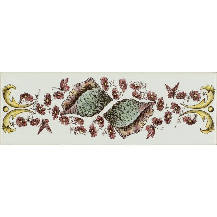 A decorative ceramic tile with greenish-gray conch shells pink flowers and yellow butterflies on brilliant white background