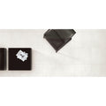 Select Bianco Matt 60 x 60cm cream ceramic tiles with a black leather chair
