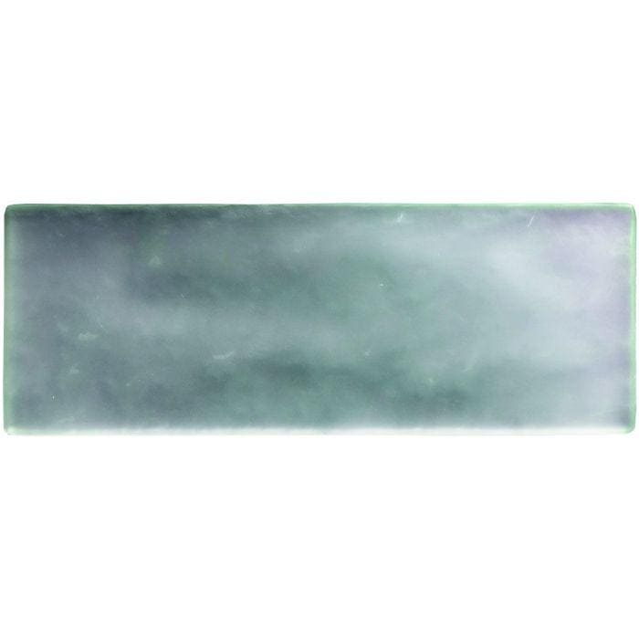 A rectangular silver frost brick radiance ceramic tile with a smooth matte finish and muted green gray swirling patterns