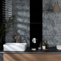 Spun Silk Silver on Black dark grey silver glass tiles with a sink and rose gold tap