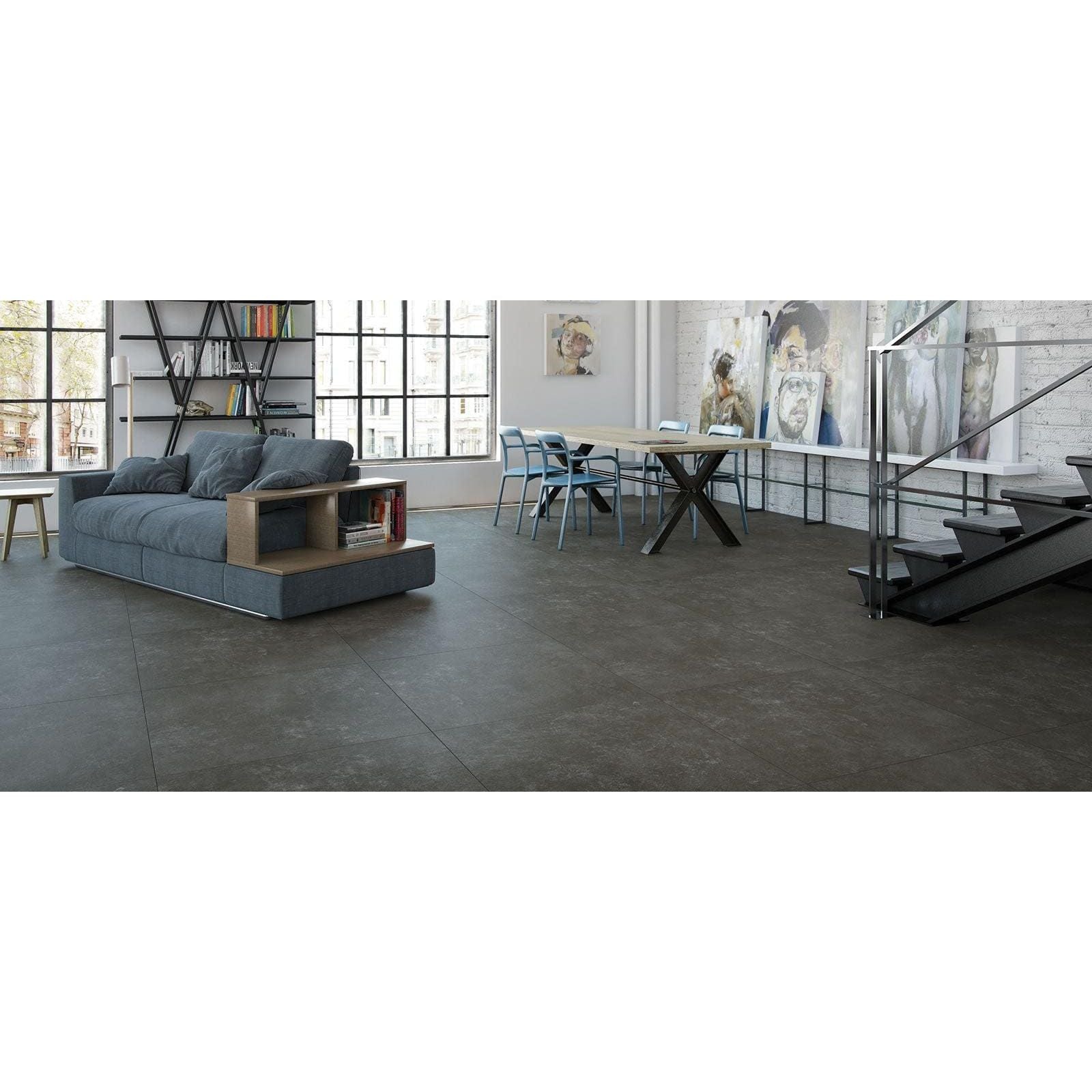 Tanum Plomo Matt 60 x 60cm dark grey concrete-effect tiles with a grey sectional sofa