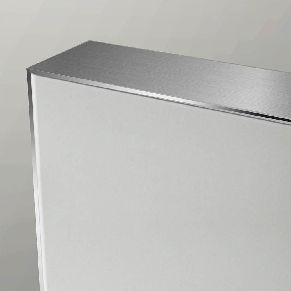 Silver-finished metal top edge on a sleek white cabinet of the tate rectangular mirror 70 polished