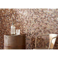 Copper-toned textured glass mosaic wall with shimmering reflective surface in varying square tile shades from Texturas Duna