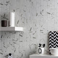 White marble-effect mosaic tile wall with gray veining made from torcello white square mosaic recycled glass