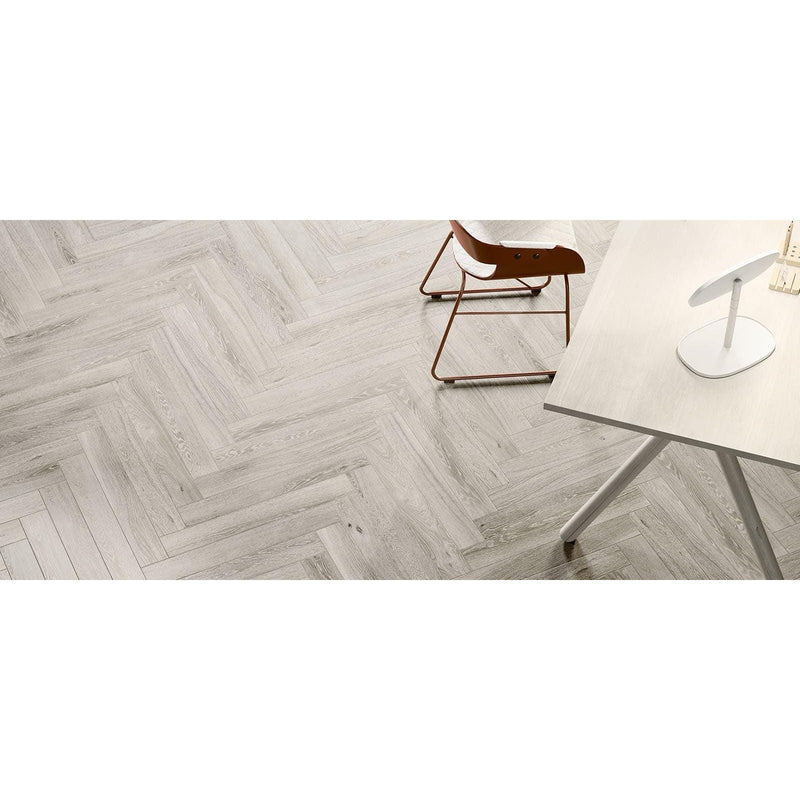 Gray wood grain herringbone patterned floor tiles from tree charme white matt collection in matt finish