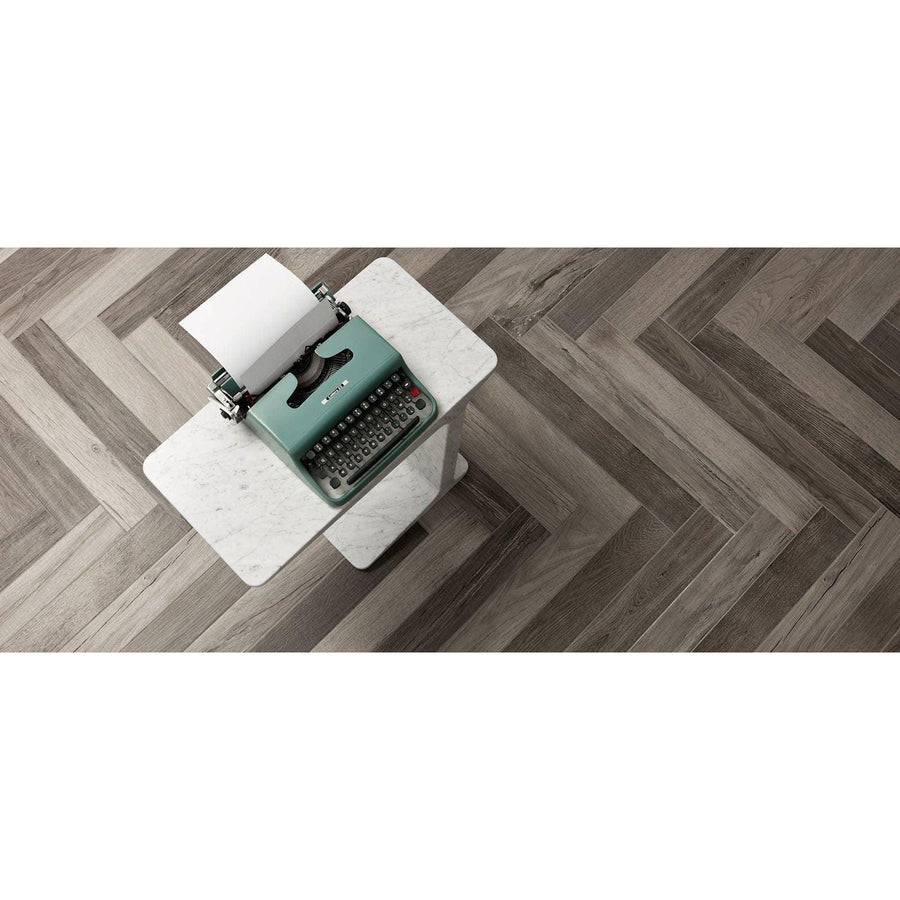 Mint green vintage typewriter with black keys and metallic accents in the Tree-Fusion Grey product line