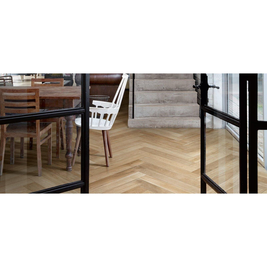 Light-colored wooden floor in a herringbone pattern from tree-fusion neutral collection