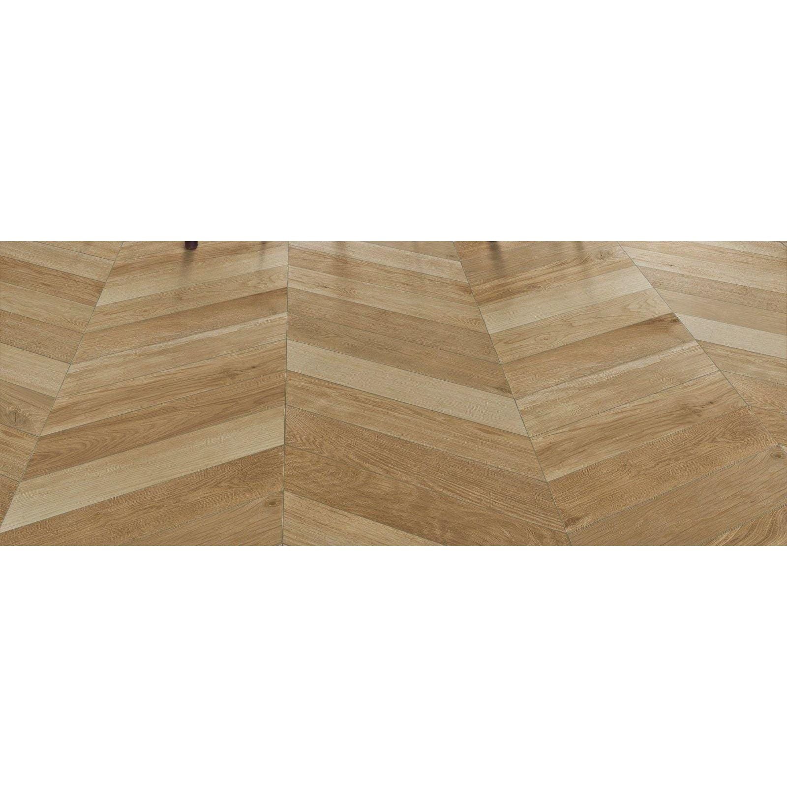 Light oak-colored hardwood floor with herringbone pattern in tree-soul neutral chevron matt finish