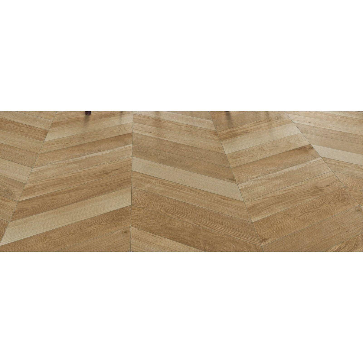 Light oak-colored hardwood floor with herringbone pattern in tree-soul neutral chevron matt finish