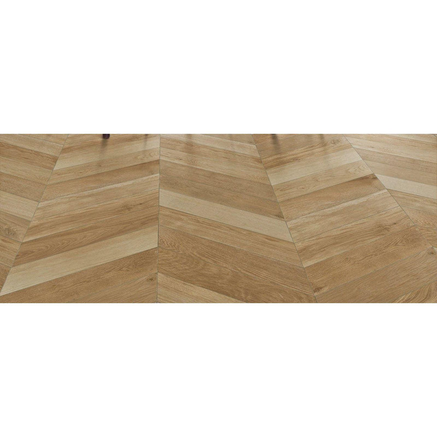 Light oak-colored hardwood floor with herringbone pattern in tree-soul neutral chevron matt finish