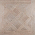 Light gray wood-effect floor tile in a herringbone pattern from the versailles taupe collection