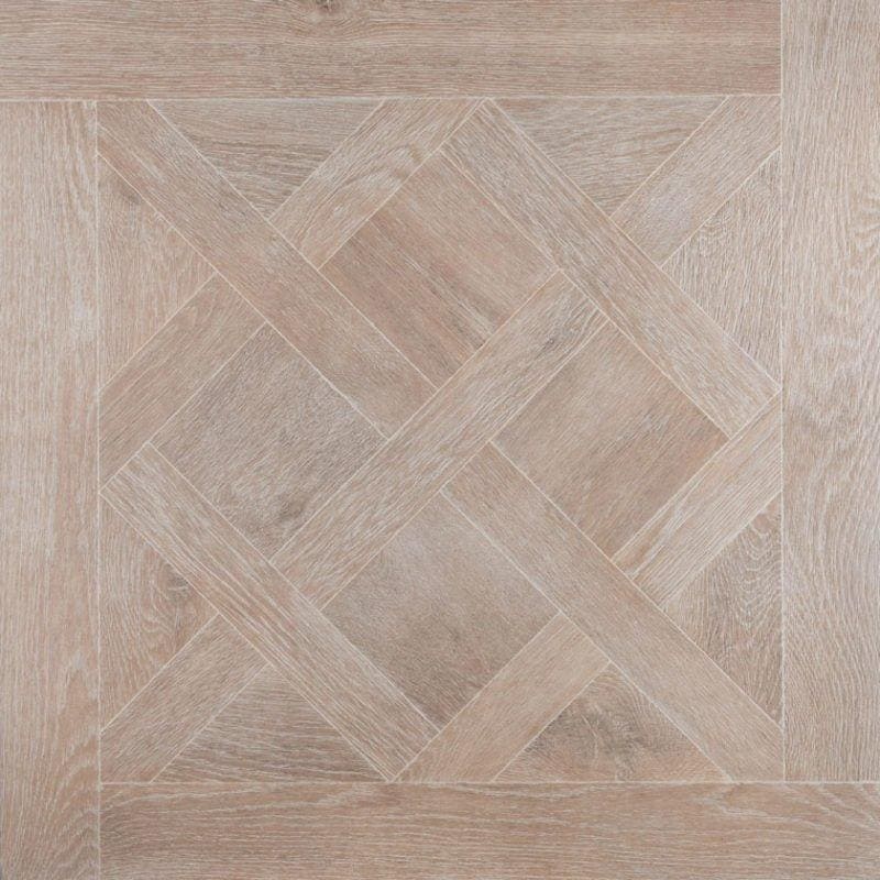 Light gray wood-effect floor tile in a herringbone pattern from the versailles taupe collection